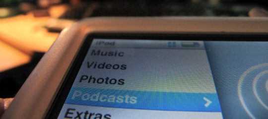 A picture of an iPod with "Podcasts" selected